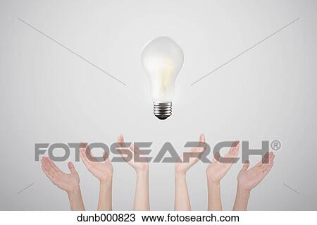 Hands with light bulb View Large Photo Image Stock Image - Hands with light bulb. Fotosearch
