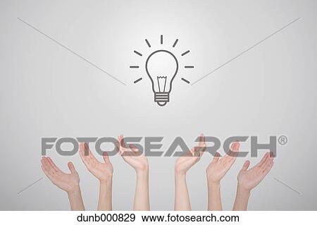 Stock Photo - Hands with light bulb. Fotosearch