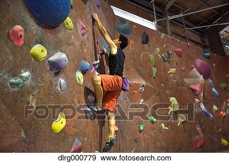 Japanese bouldering athlete in action View Large Photo Image Stock Photo - Japanese bouldering athlete in action. Fotosearch