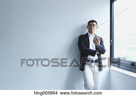 Japanese businessman in a modern office View Large Photo Image Picture - Japanese businessman in a modern office. Fotosearch