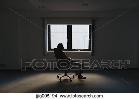 Picture - Japanese businessman in a modern office. Fotosearch