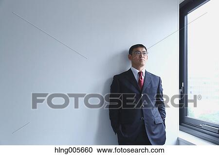 Japanese businessman in a modern office View Large Photo Image Stock Image - Japanese businessman in a modern office. Fotosearch