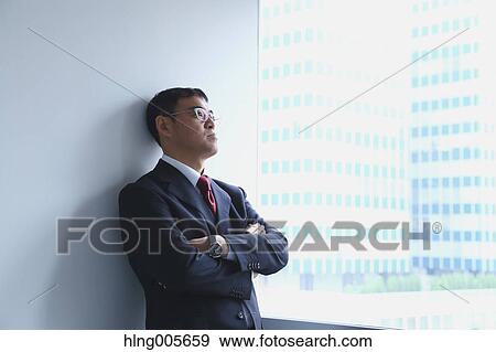 Japanese businessman in a modern office View Large Photo Image Stock Photo - Japanese businessman in a modern office. Fotosearch
