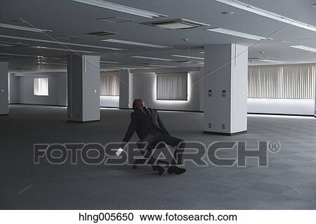Japanese businessman in empty office View Large Photo Image Stock Image - Japanese businessman in empty office. Fotosearch