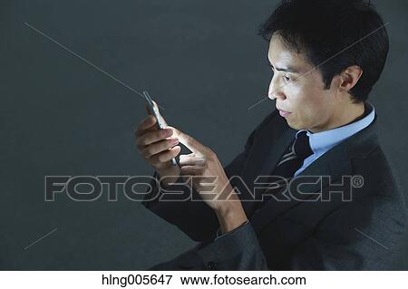 Japanese businessman in empty office View Large Photo Image Stock Photo - Japanese businessman in empty office. Fotosearch