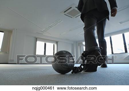 Japanese businessman with ball and chain View Large Photo Image Stock Image - Japanese businessman with ball and chain. Fotosearch
