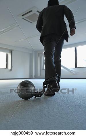 Japanese businessman with ball and chain View Large Photo Image Stock Photo - Japanese businessman with ball and chain. Fotosearch