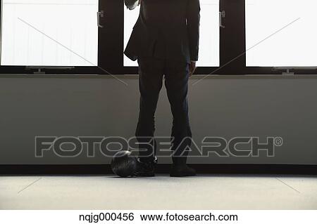 Japanese businessman with ball and chain View Large Photo Image Stock Photograph - Japanese businessman with ball and chain. Fotosearch