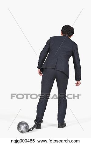 Japanese businessman with ball and chain View Large Photo Image Stock Photography - Japanese businessman with ball and chain. Fotosearch