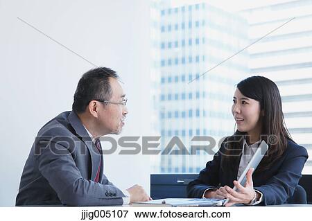 Japanese businesspeople in a modern office View Large Photo Image Stock Photo - Japanese businesspeople in a modern office. Fotosearch