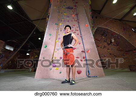 Japanese climbing athlete getting ready to climb gym wall View Large Photo Image Stock Image - Japanese climbing athlete getting ready to climb gym wall. Fotosearch