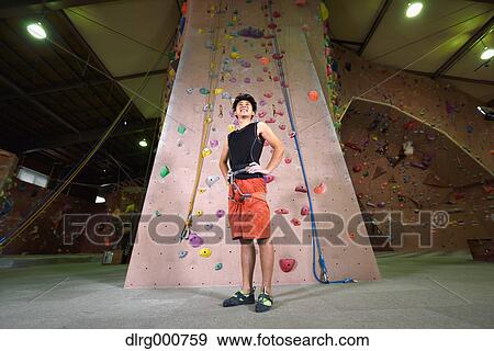 Japanese climbing athlete getting ready to climb gym wall View Large Photo Image Stock Photo - Japanese climbing athlete getting ready to climb gym wall. Fotosearch