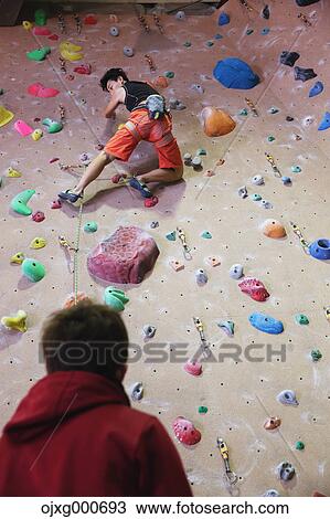 Stock Image - Japanese climbing athlete in action. Fotosearch