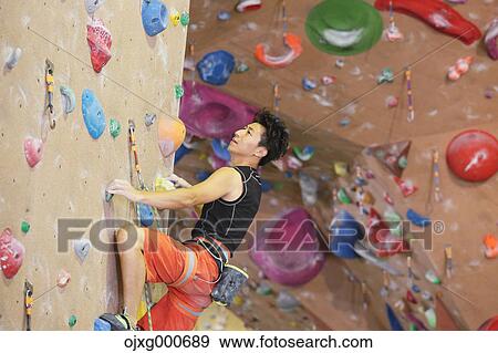 Japanese climbing athlete in action View Large Photo Image Stock Photo - Japanese climbing athlete in action. Fotosearch
