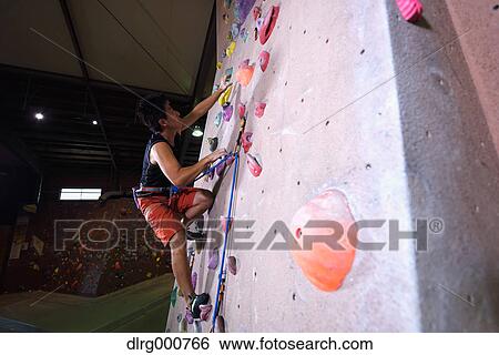 Japanese climbing athlete in action View Large Photo Image Stock Photograph - Japanese climbing athlete in action. Fotosearch
