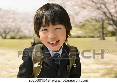 Japanese elementary school student and cherry blossoms View Large Photo Image Stock Photo - Japanese elementary school student and cherry blossoms. Fotosearch