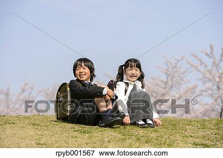 Japanese elementary school students and cherry blossoms View Large Photo Image Stock Photo - Japanese elementary school students and cherry blossoms. Fotosearch