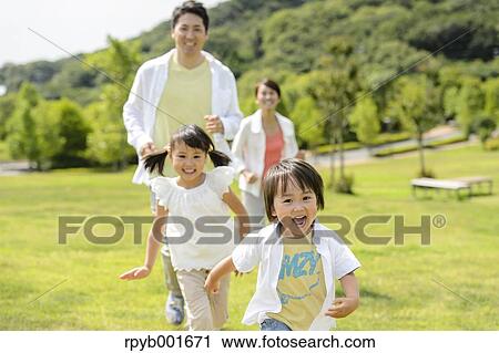 Stock Image - Japanese family at the park. Fotosearch