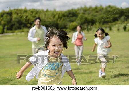 Stock Photography - Japanese family at the park. Fotosearch