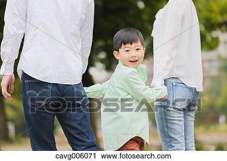 Japanese family in a city park View Large Photo Image Stock Image - Japanese family in a city park. Fotosearch