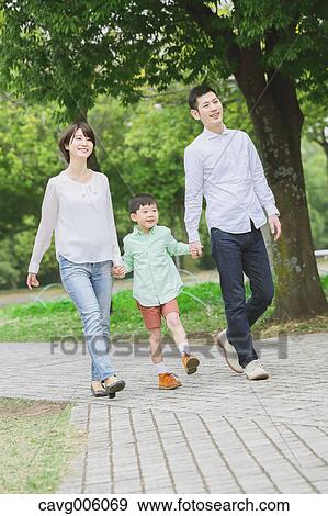 Stock Photo - Japanese family in a city park. Fotosearch