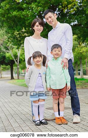 Japanese family in a city park View Large Photo Image Stock Photo - Japanese family in a city park. Fotosearch