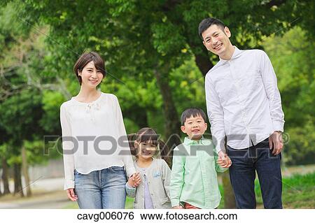 Stock Photograph - Japanese family in a city park. Fotosearch