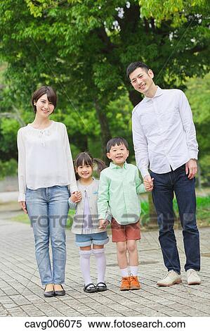 Stock Photography - Japanese family in a city park. Fotosearch