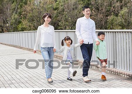 Stock Photography - Japanese family in a city park. Fotosearch