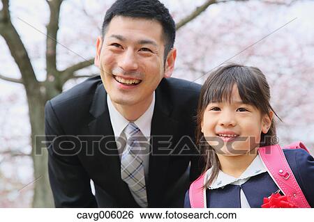 Japanese father and daughter with cherry blossoms in a city park View Large Photo Image Stock Photograph - Japanese father and daughter with cherry blossoms in a city park. Fotosearch