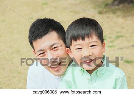 Japanese father and son in a city park View Large Photo Image Stock Photography - Japanese father and son in a city park. Fotosearch
