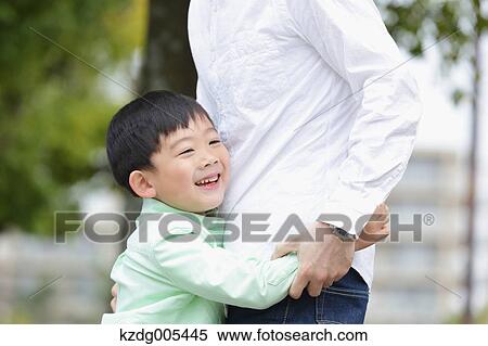 Japanese father and son in a city park View Large Photo Image Stock Photography - Japanese father and son in a city park. Fotosearch