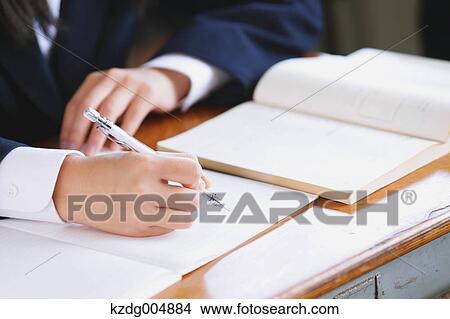 Picture - Japanese high-school student during a lesson. Fotosearch