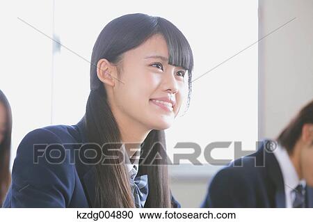 Stock Image - Japanese high-school student during a lesson. Fotosearch