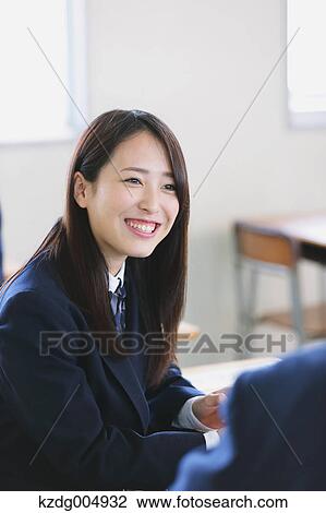 Stock Image - Japanese high-school student during a lesson. Fotosearch