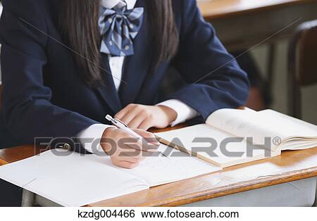 Stock Photograph - Japanese high-school student during a lesson. Fotosearch
