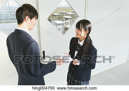 Japanese high-school student giving love letter View Large Photo Image Stock Image - Japanese high-school student giving love letter. Fotosearch