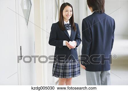 Japanese high-school student giving present View Large Photo Image Stock Image - Japanese high-school student giving present. Fotosearch