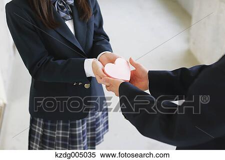 Japanese high-school student giving present View Large Photo Image Stock Photography - Japanese high-school student giving present. Fotosearch