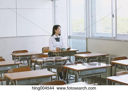 Japanese high-school student in empty classroom View Large Photo Image Picture - Japanese high-school student in empty classroom. Fotosearch