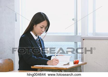 Japanese high-school student in empty classroom View Large Photo Image Picture - Japanese high-school student in empty classroom. Fotosearch