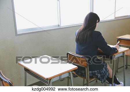 Japanese high-school student in empty classroom View Large Photo Image Stock Image - Japanese high-school student in empty classroom. Fotosearch