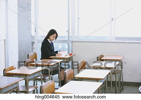 Stock Photography - Japanese high-school student in empty classroom. Fotosearch