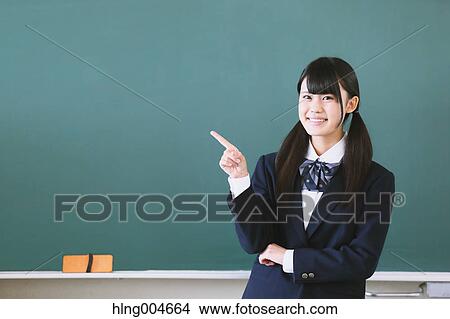 Japanese high-school student in front of classroom blackboard View Large Photo Image Picture - Japanese high-school student in front of classroom blackboard. Fotosearch
