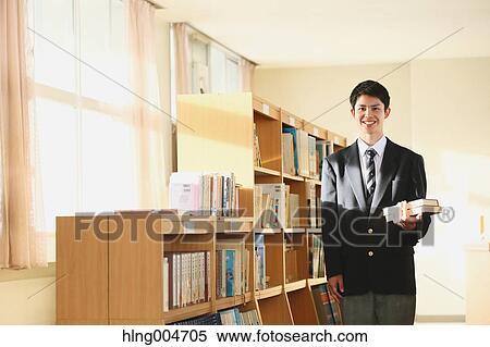 Stock Photography - Japanese high-school student in the school library. Fotosearch