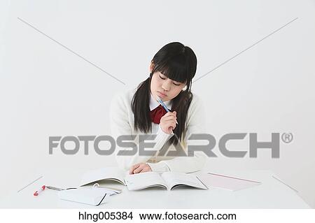 Picture - Japanese High-school student in uniform against white background. Fotosearch