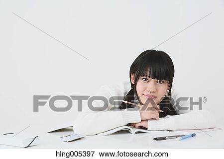 Japanese High-school student in uniform against white background View Large Photo Image Stock Photo - Japanese High-school student in uniform against white background. Fotosearch