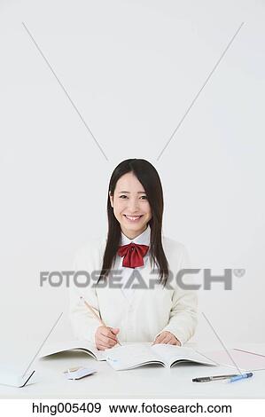 Japanese High-school student in uniform against white background View Large Photo Image Stock Photo - Japanese High-school student in uniform against white background. Fotosearch