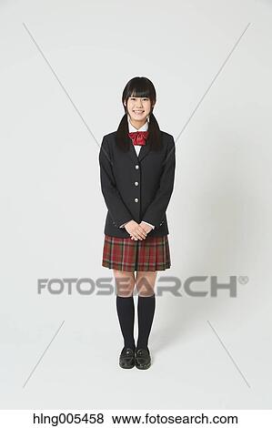 Japanese High-school student in uniform against white background View Large Photo Image Stock Photo - Japanese High-school student in uniform against white background. Fotosearch