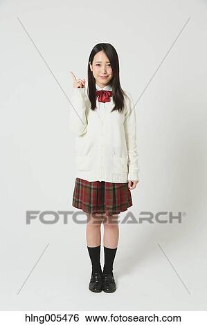 Japanese High-school student in uniform against white background View Large Photo Image Stock Photograph - Japanese High-school student in uniform against white background. Fotosearch